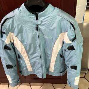 Baby blue woman’s Cortech motorcycle jacket.